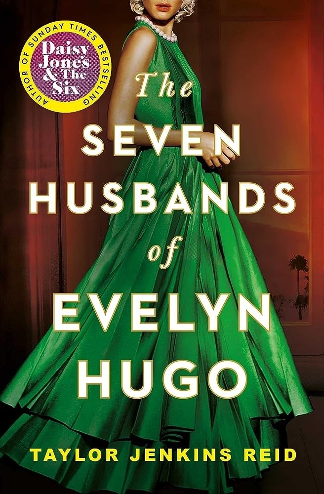 Book cover of "The Seven Husbands of Evelyn Hugo" by Taylor Jenkins Reid: a woman in a flowing dress stands against a dark background