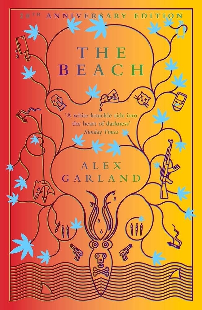 Book cover of "The Beach" by Alex Garland, 20th Anniversary Edition. Features various illustrations including a skull, gun, and leaves on a gradient background