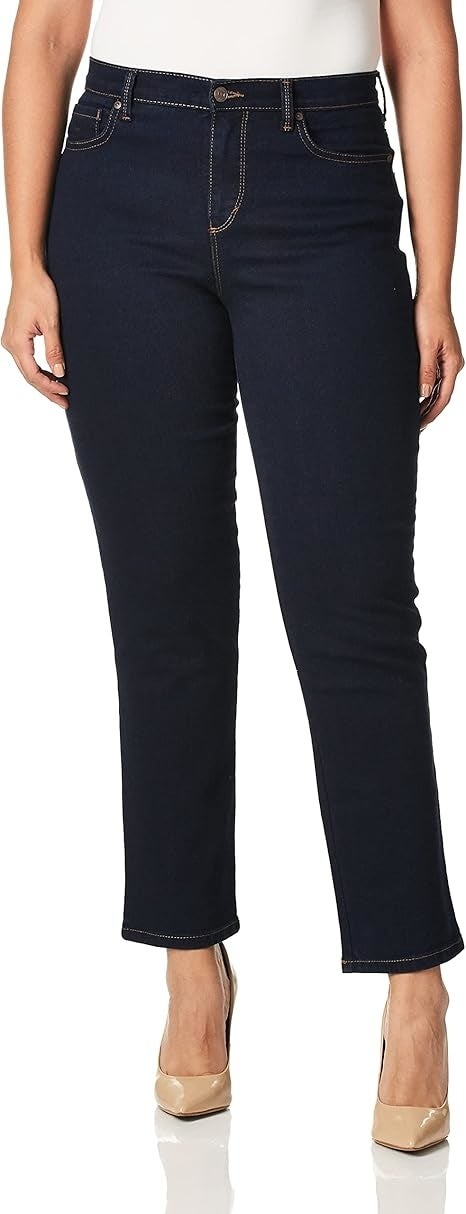 Person wearing acheronian  lavation  denim jeans and nude heels.
