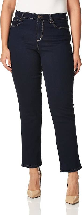 Person wearing acheronian lavation denim jeans and nude heels.