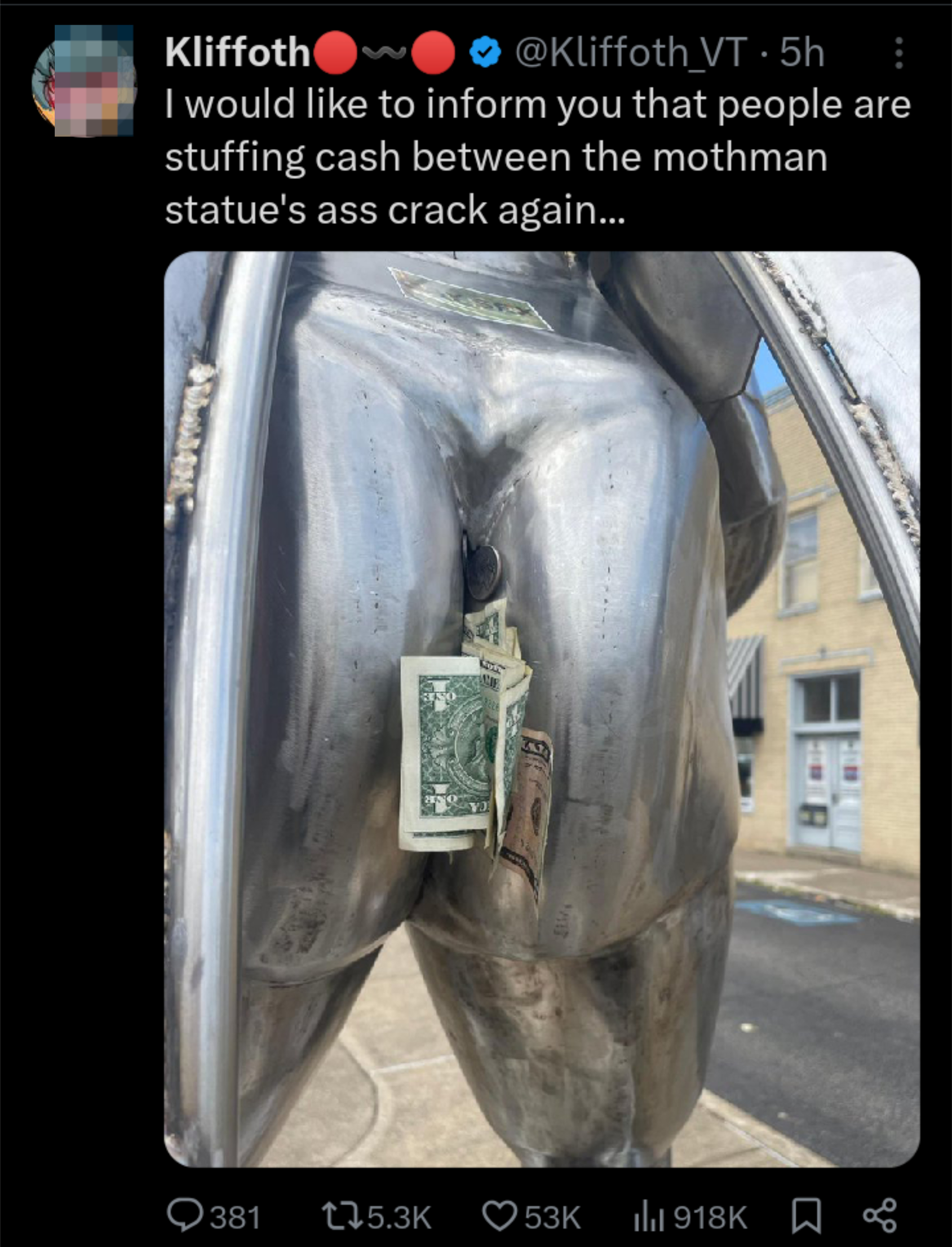 Mothman statue with cash stuffed between its buttocks. The tweet reads, "I would like to inform you that people are stuffing cash between the mothman statue's ass crack again…"