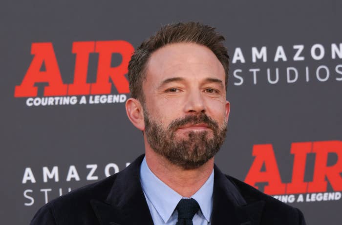 Ben Affleck on a red carpet in a suit and tie, attending the premiere of "Air: Courting a Legend."