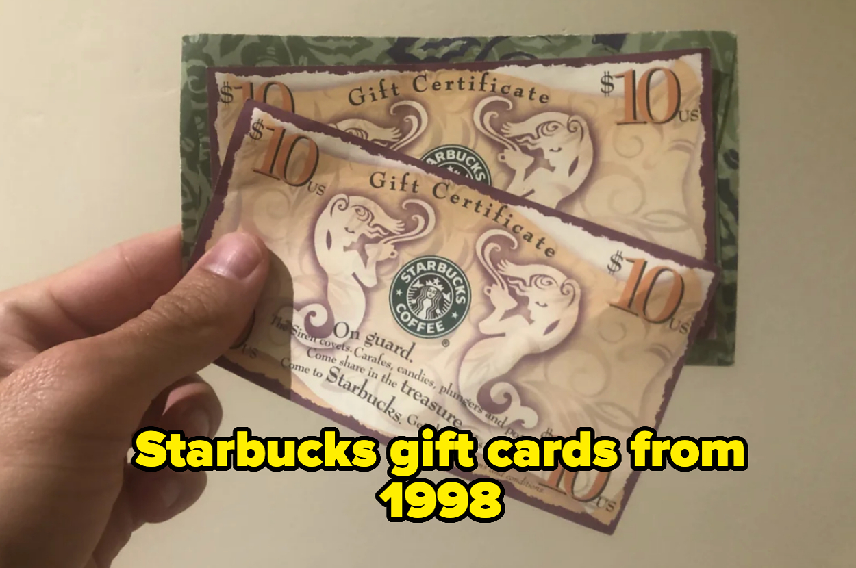 Two Starbucks "Gift Certificate" cards from 1998 with a $10 value each held in a person's hand. Text reads, "Starbucks gift cards from 1998."