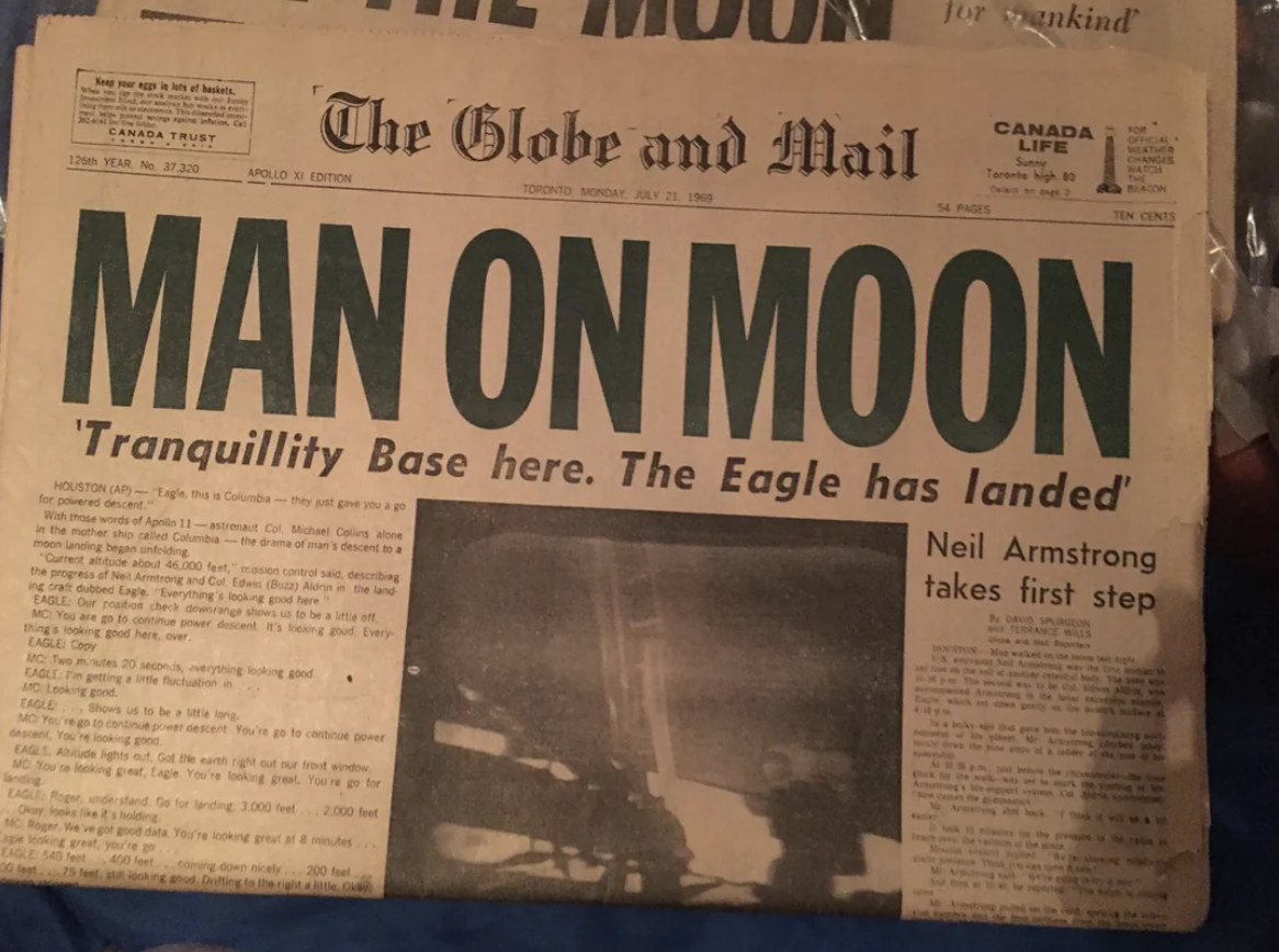 Front page of The Globe and Mail with the headline: "MAN ON MOON," reporting the Moon landing on July 21, 1969, featuring Neil Armstrong's first step