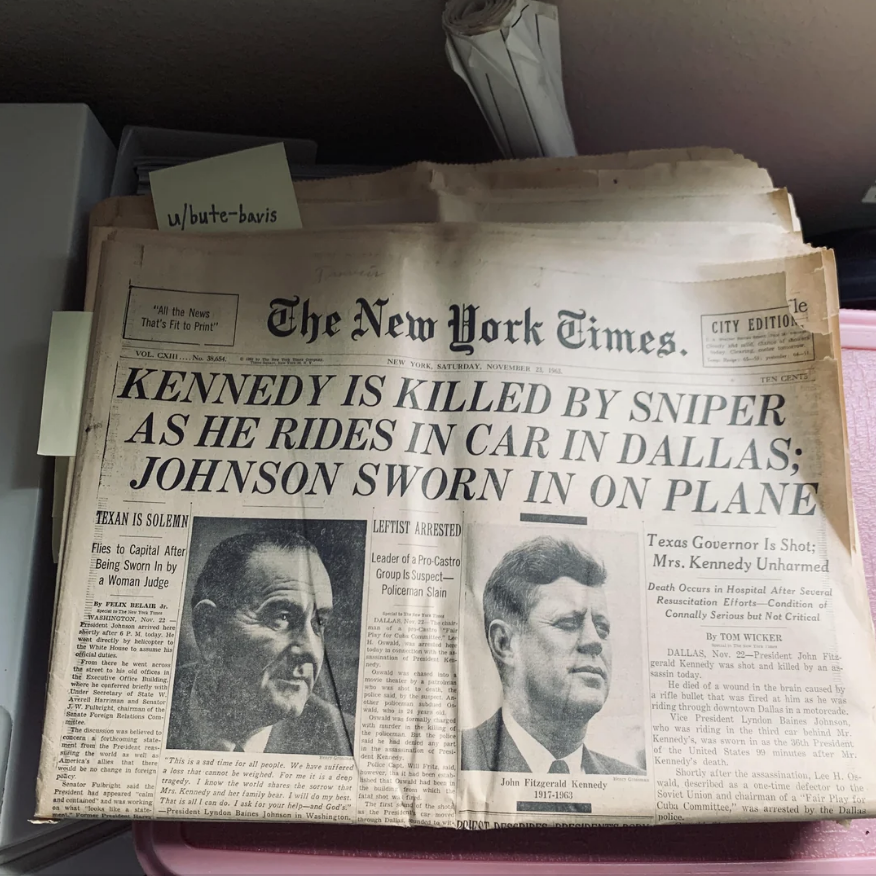 Front page of The New York Times with headline: "KENNEDY IS KILLED BY SNIPER AS HE RIDES IN CAR IN DALLAS; JOHNSON SWORN IN ON PLANE." Images of John F. Kennedy and Lyndon B. Johnson