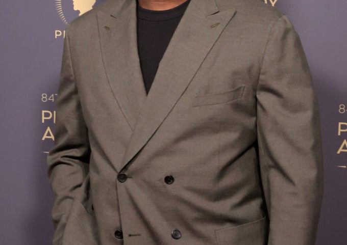 Lionel Boyce smiles on the red carpet at the Peabody Awards, wearing a double-breasted blazer