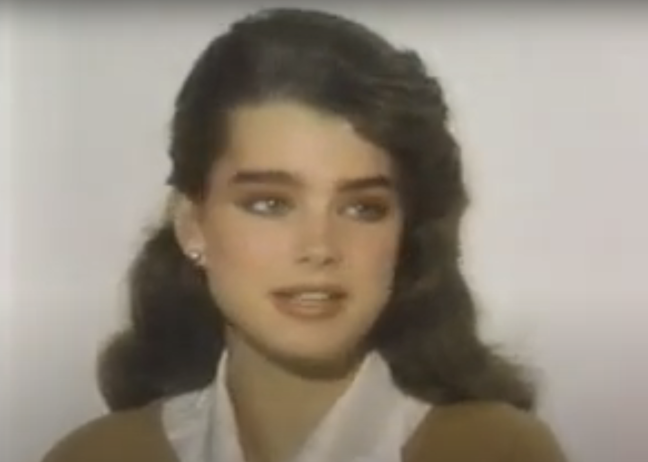 Brooke Shields in an interview, wearing a collared shirt