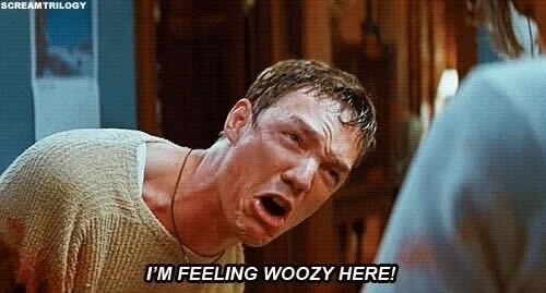 Man with a distressed expression says, "I'M FEELING WOOZY HERE!" in a caption
