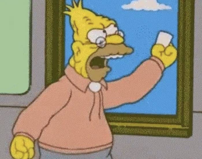 Grandpa Simpson angrily waves a white card while yelling, with a window in the background
