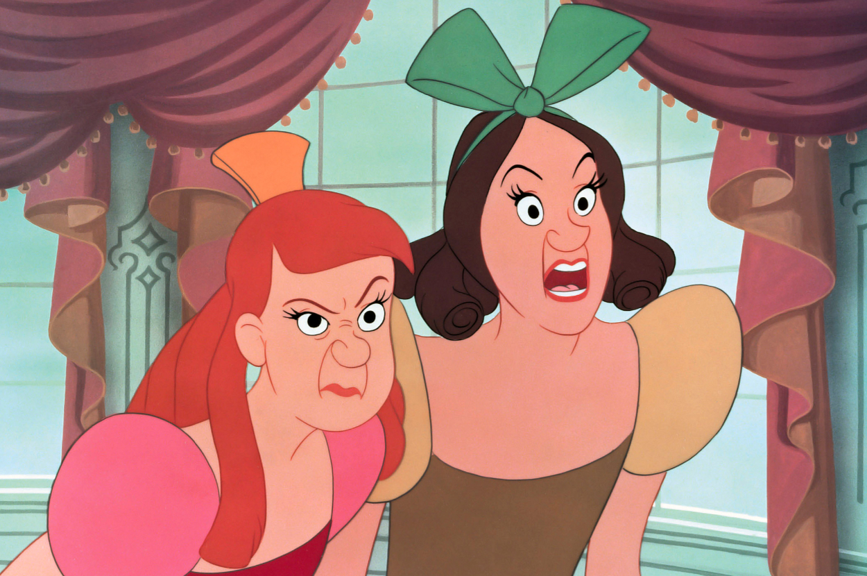 Stepsisters Anastasia and Drizella from Disney's Cinderella are angrily making faces, with mouths open wide, under an ornate window backdrop