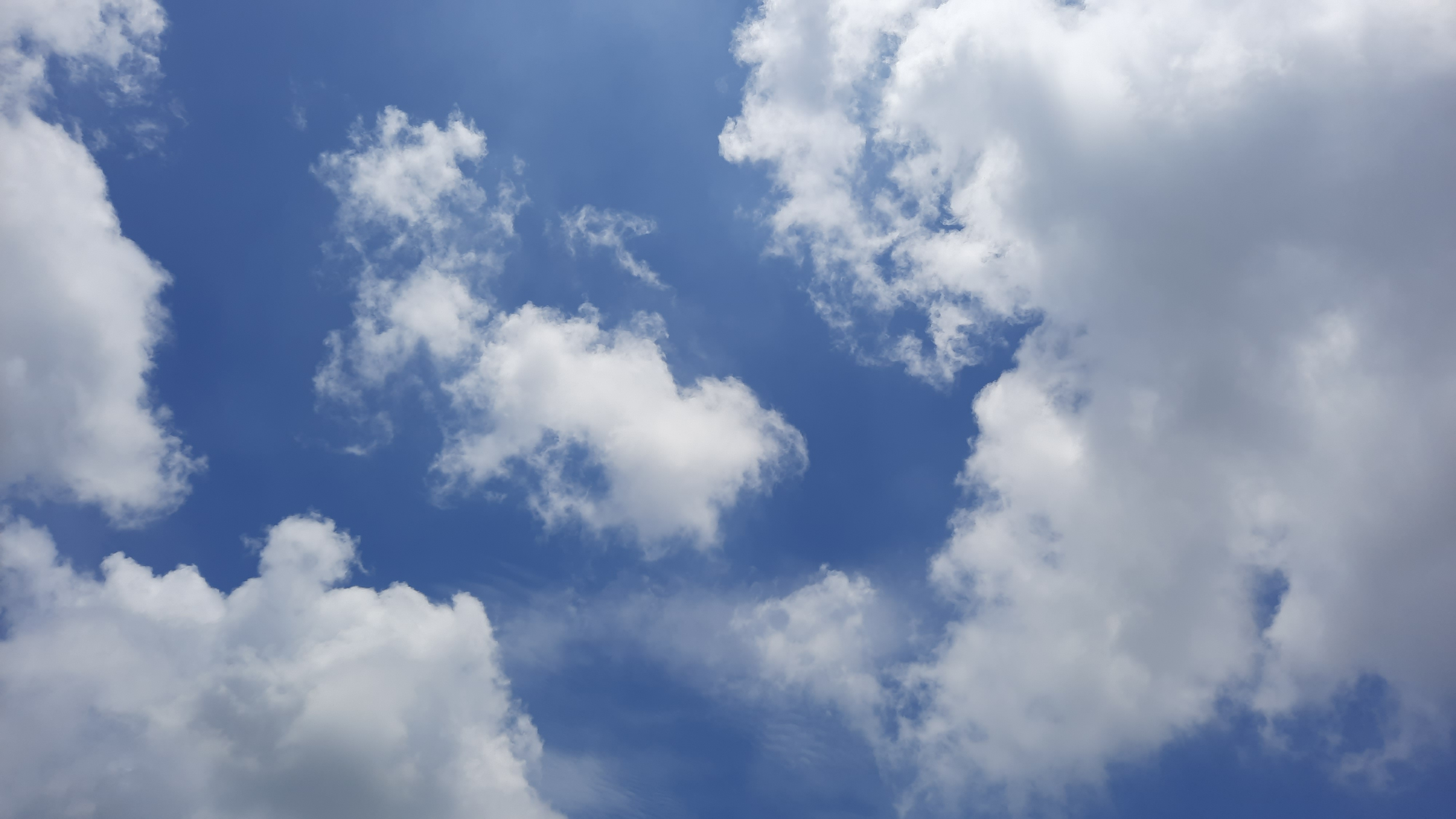 Clouds scattered across a clear sky