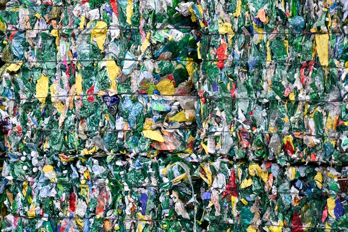 Bales of compacted, colorful plastic waste ready for recycling