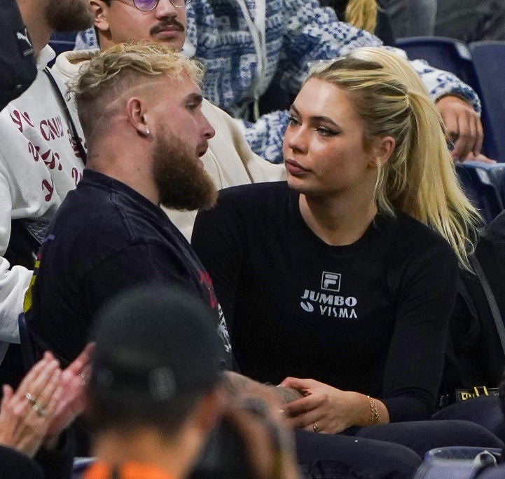 Jake Paul sits and talks with Jutta Leerdam at a sports event