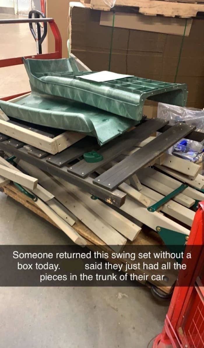 A disassembled swing set is placed on a pallet. A caption reads: "Someone returned this swing set without a box today. Said they just had all the pieces in the trunk of their car."