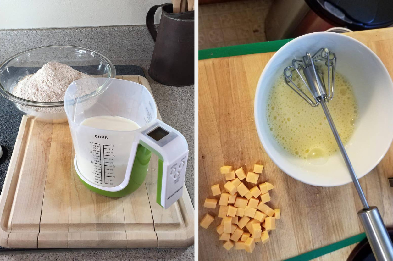 Mixing dry and wet ingredients for a recipe: flour, measuring cup with liquid, and cheese cubes next to a bowl of beaten eggs with a whisk