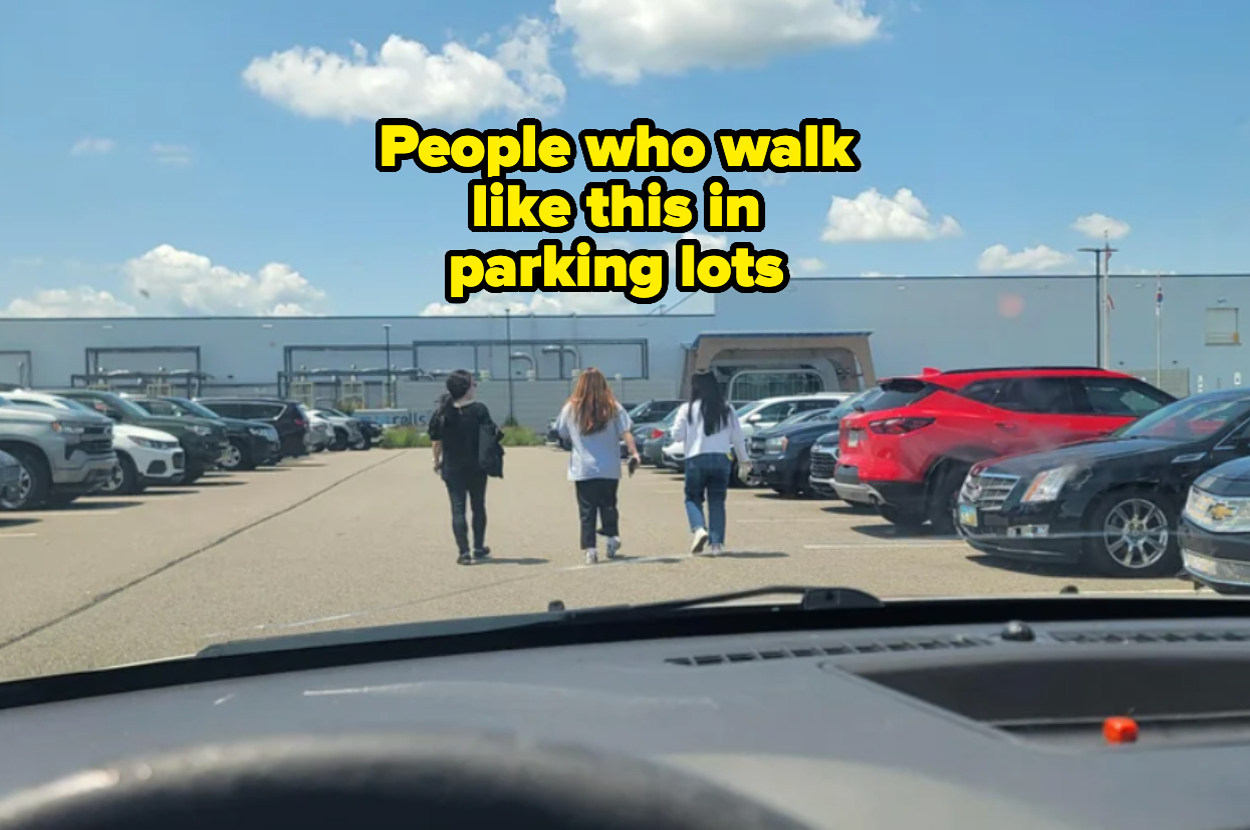 Three people walking in the middle of a parking lot, viewed from inside a car, with the caption: "People who walk like this in parking lots."