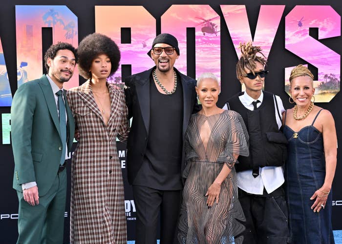 Kenya Barris, Willow Smith, Will Smith, Jada Pinkett Smith, Jaden Smith, and Angela Rye on the red carpet in fashionable attire at a premiere event