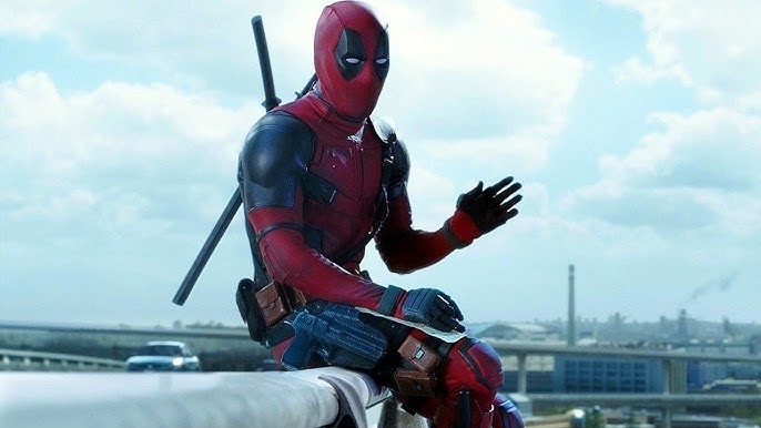 Deadpool, in his signature suit, sits casually on a bridge, waving