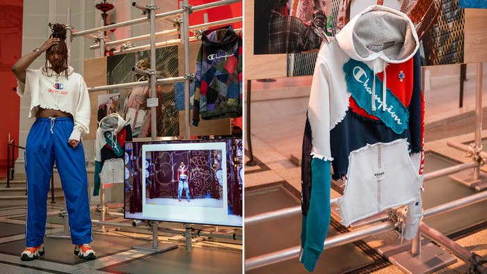 Mixed-media art exhibit showcases Champion clothing items, including custom-made hoodies and a vintage-themed piece seen on a digital display