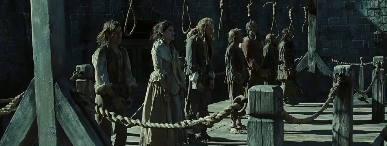 A scene from "Pirates of the Caribbean" showing Elizabeth Swann (Keira Knightley) and others standing on a gallows awaiting execution