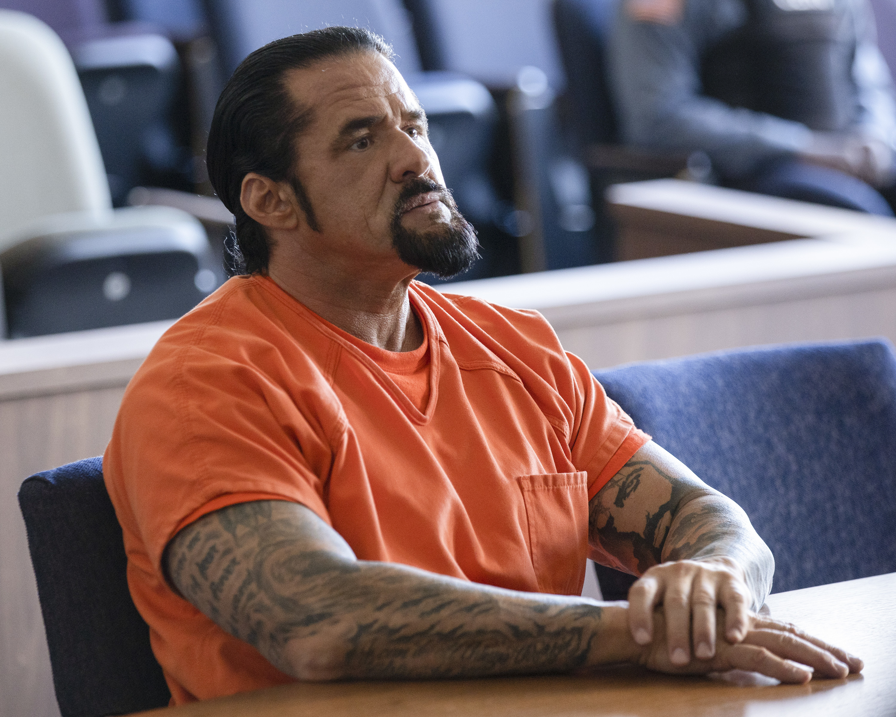 Marcus LaVoi in an orange jumpsuit in a scene from "For Life"