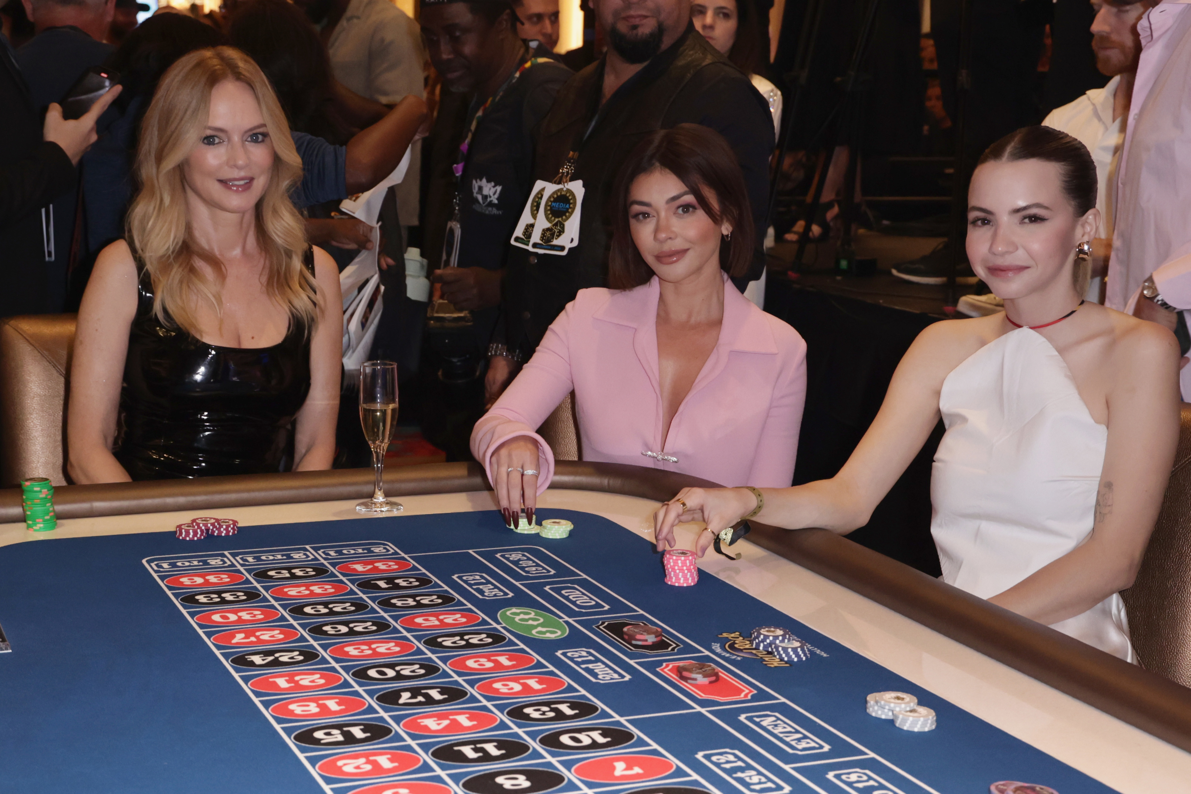 Heather Graham, Sarah Hyland, and a Bobbi play poker at a casino event