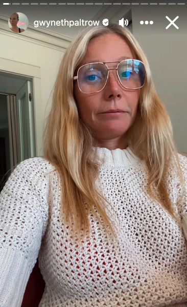 Gwyneth Paltrow appears in a white knitted sweater and large glasses