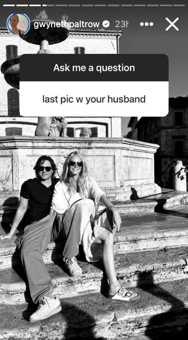 Gwyneth Paltrow and a man sit on stone steps in front of a fountain. Text above asks, "Ask me a question" and below, "last pic w your husband."