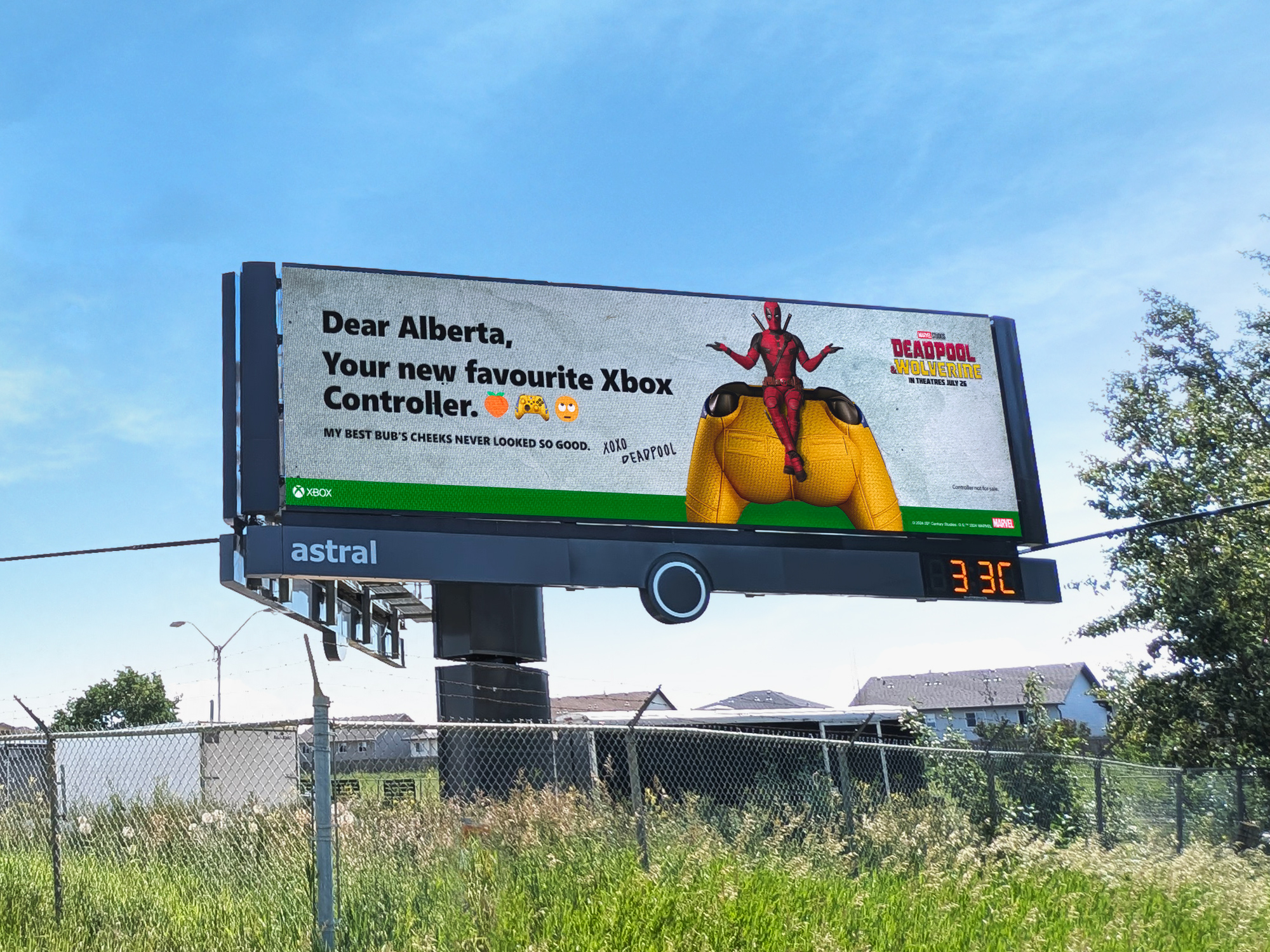 A billboard for the movie &quot;Deadpool&quot; features a humorous message from the character Deadpool about an Xbox controller for Alberta, with Deadpool posing in a playful stance