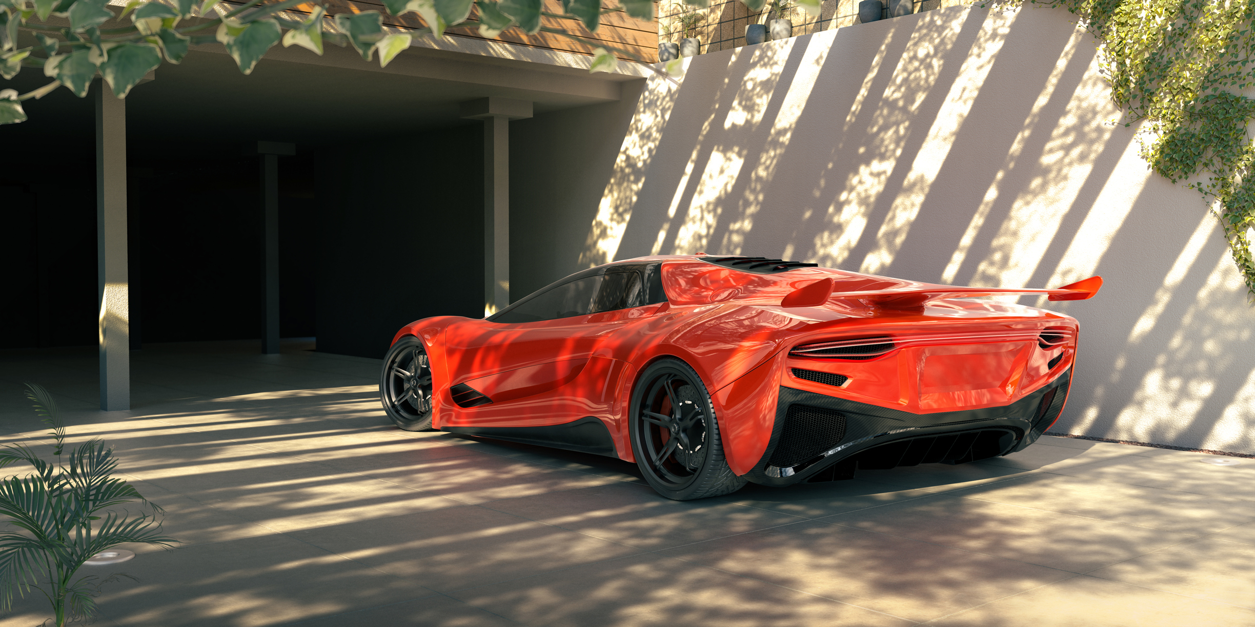 A fancy red car in a driveway