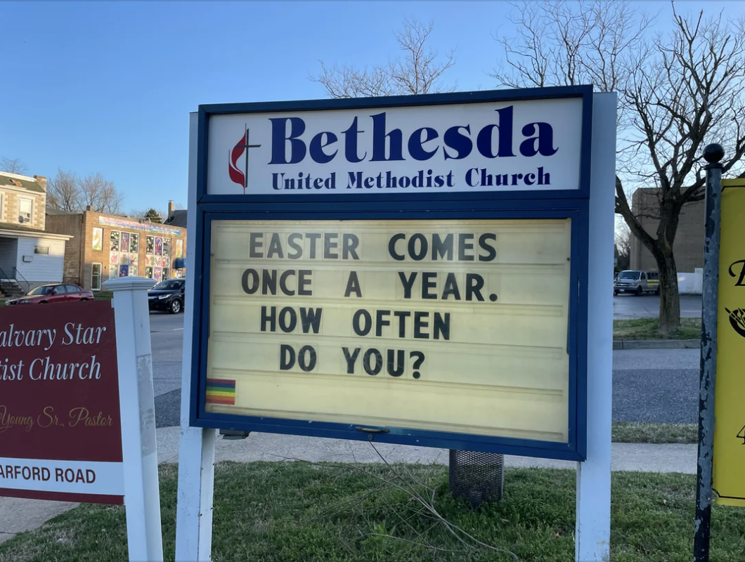Sign outside Bethesda United Methodist Church reads: "Easter comes once a year. How often do you?" A rainbow flag sticker is on the bottom left corner of the sign