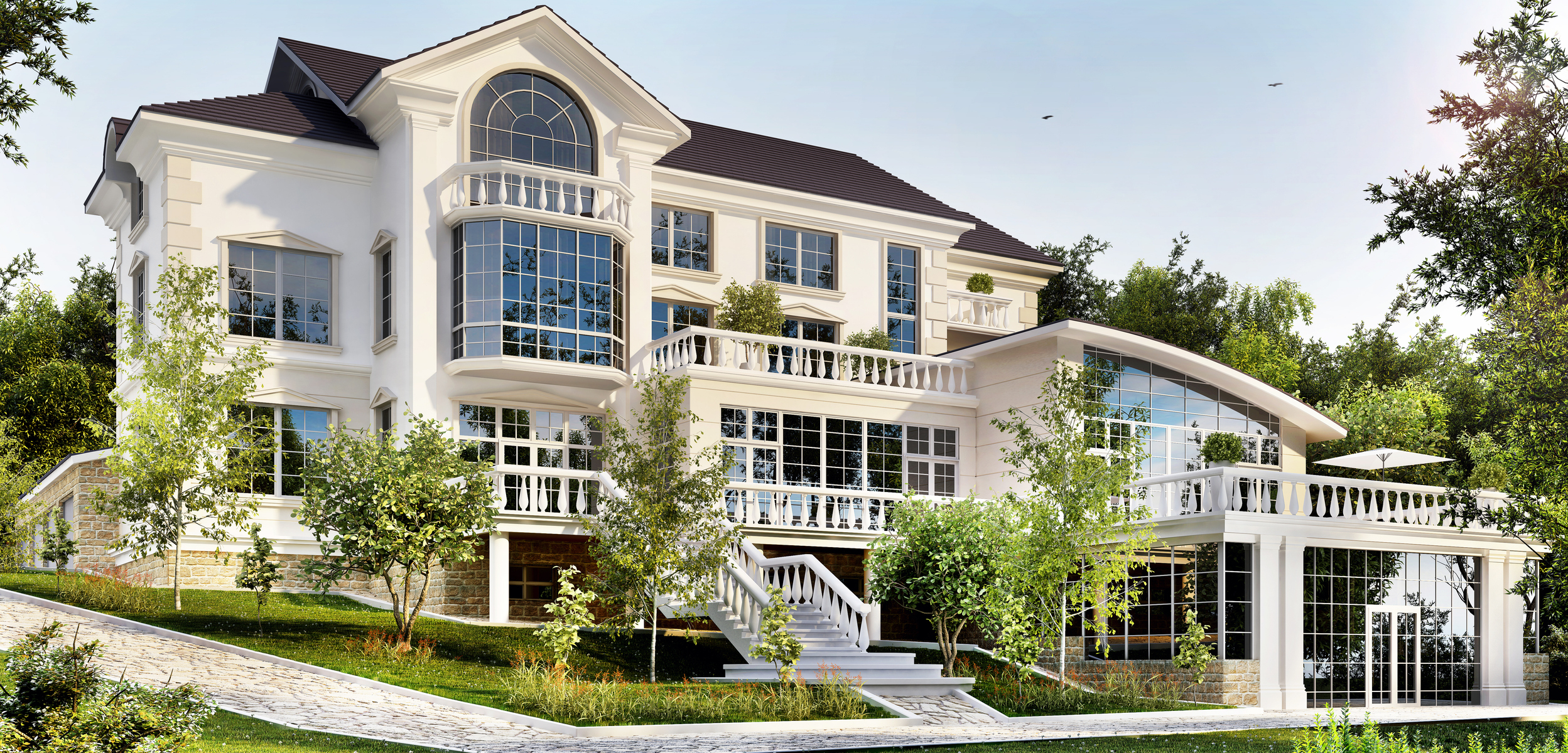 A luxurious mansion with multiple stories, large windows, a spacious veranda, and manicured lawns, surrounded by trees