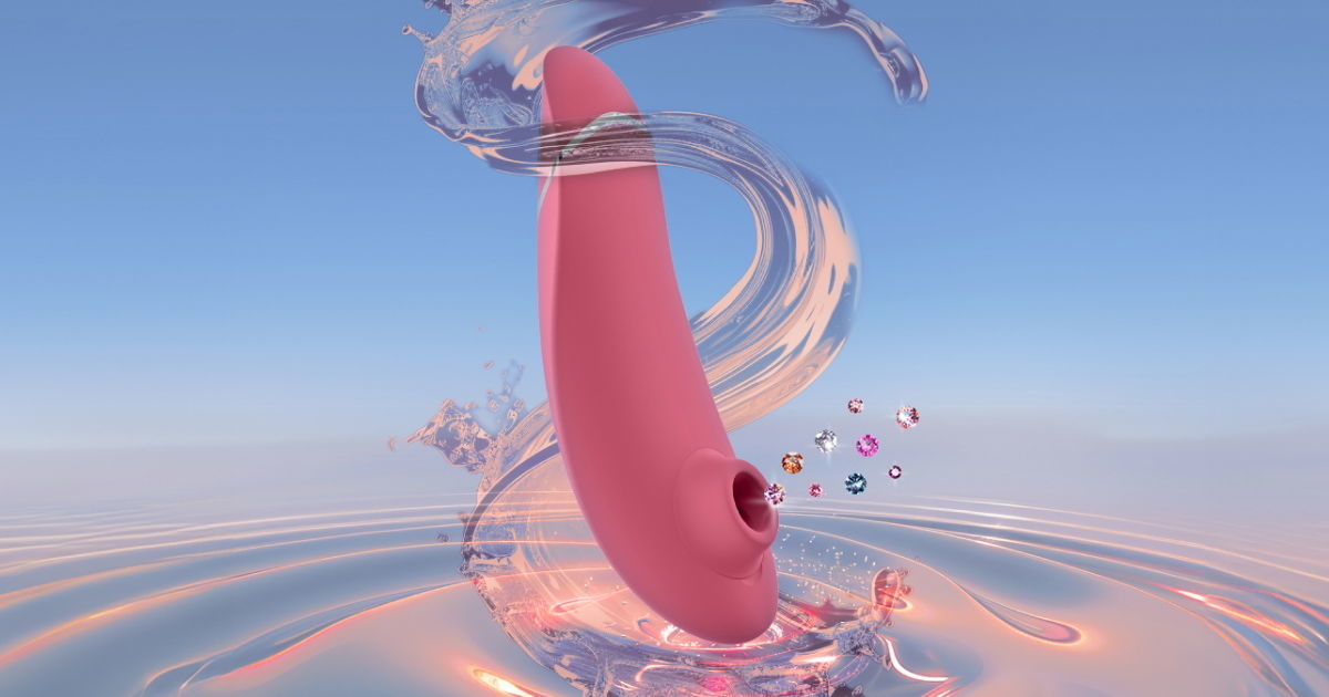 Pink personal massager with water and sparkle elements, set against a light blue background