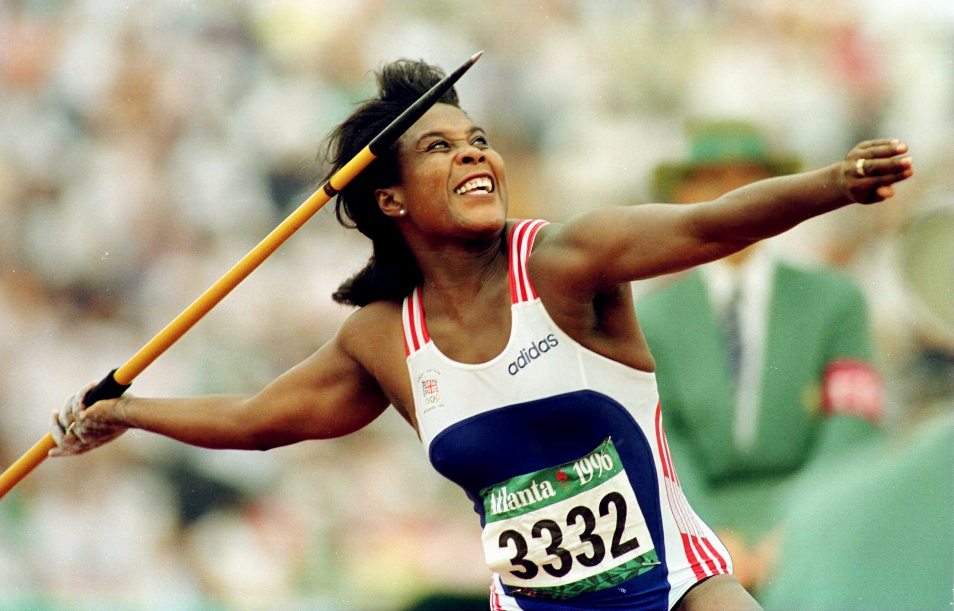 tessa, in athletic wear, is seen in mid-action competing in the javelin throw at the 1996 Atlanta Olympics