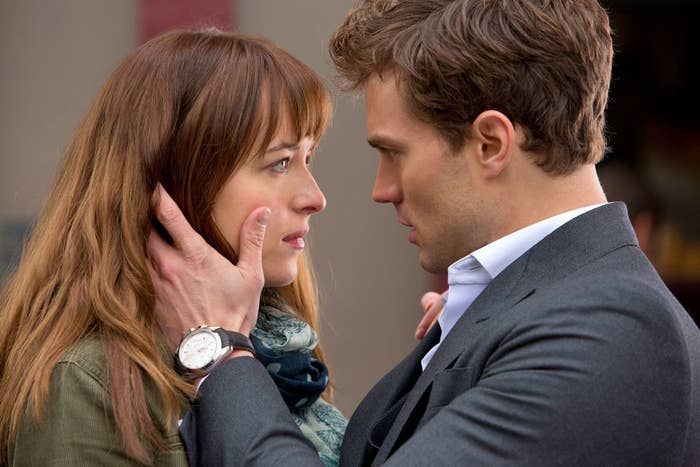 Dakota Johnson and Jamie Dornan, in a close, emotional moment from "Fifty Shades of Grey." Jamie's hand is on Dakota's face as they gaze into each other's eyes