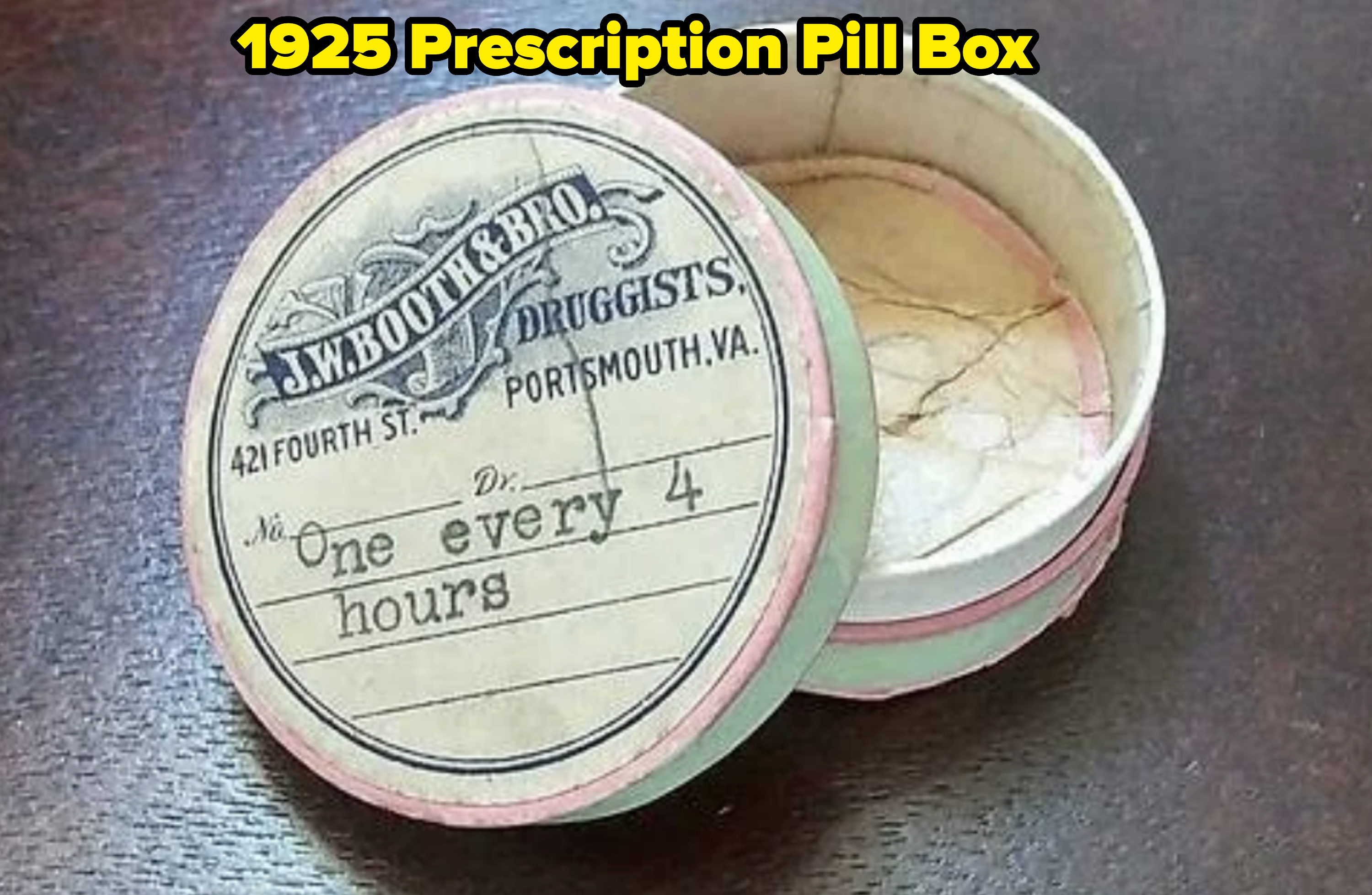 A round vintage medicine box from J.W. Booth & Bro. Druggists, labeled "One every 4 hours," with the lid partially open showing worn interior