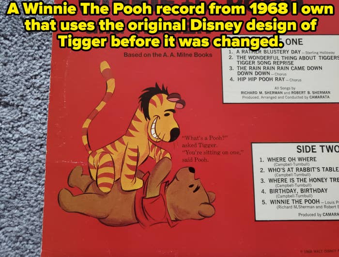 Winnie the Pooh and Tigger are featured on a red background. Pooh is lying down, while Tigger is sitting on his back, asking, &quot;What's a Pooh?&quot;