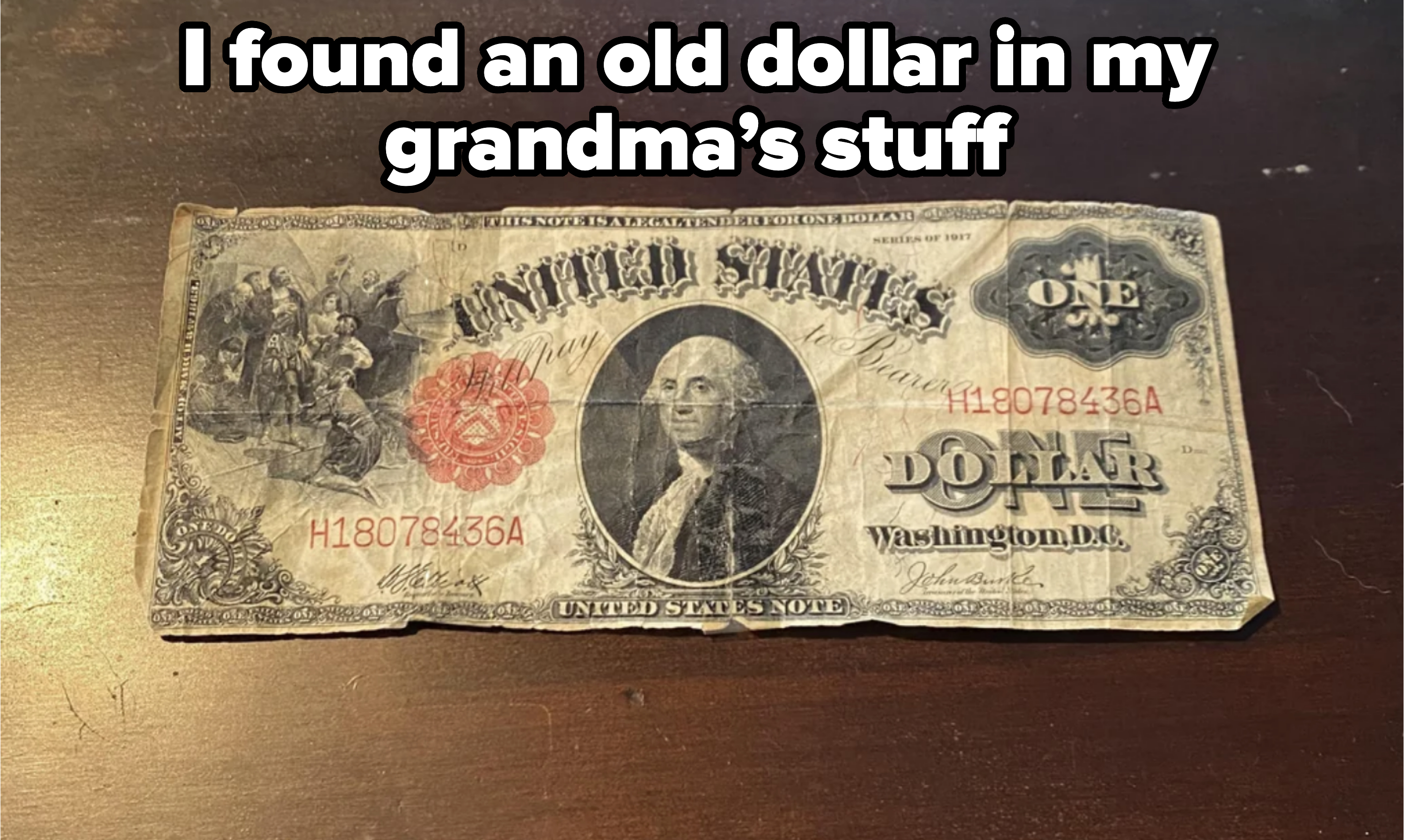 An old U.S. one dollar bill featuring a portrait of George Washington in the center, with serial numbers H18078436A in red and black