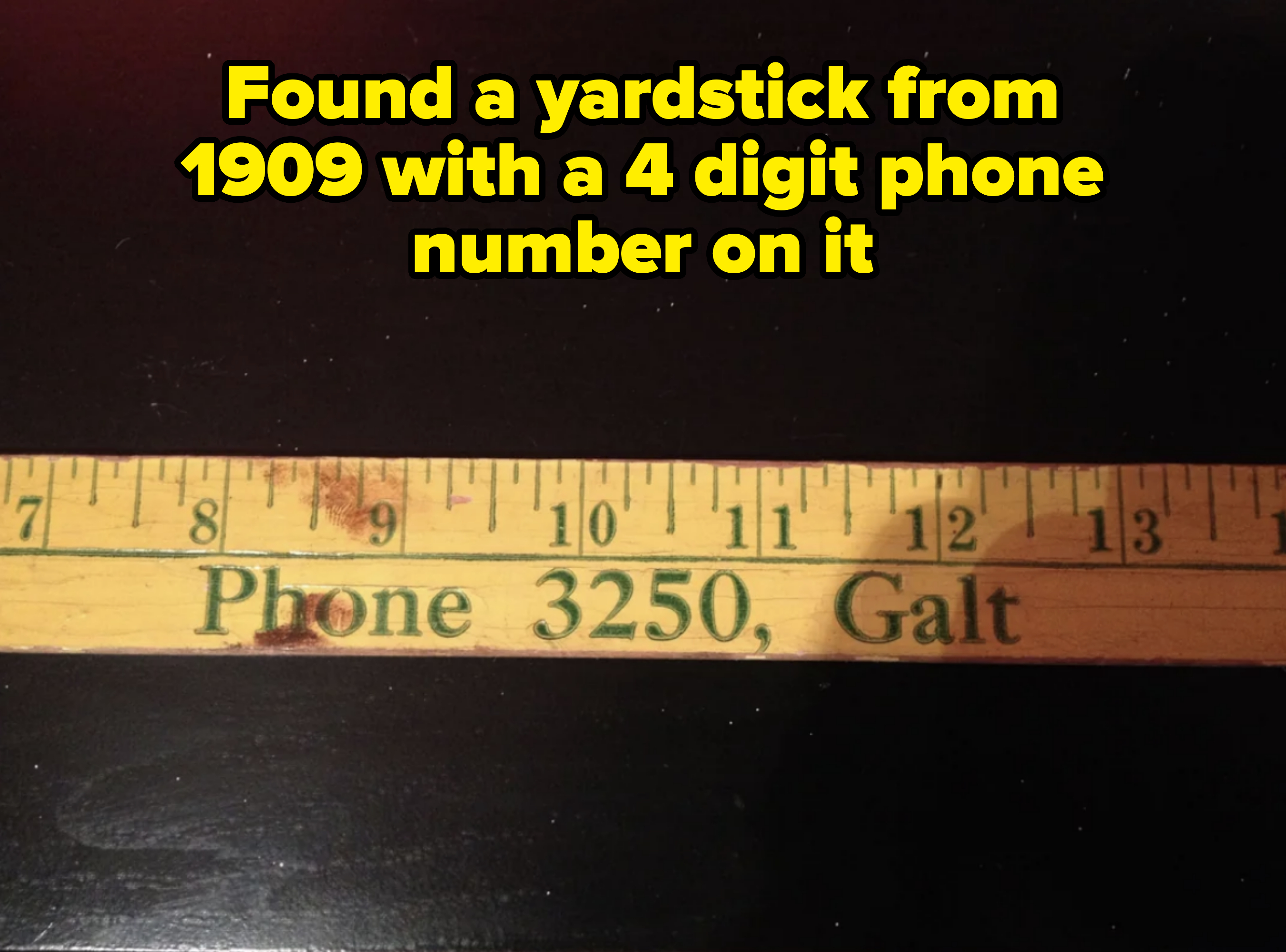 A wooden ruler with the markings from 7 to 13 inches. The text on the ruler reads "Phone 3250, Galt."