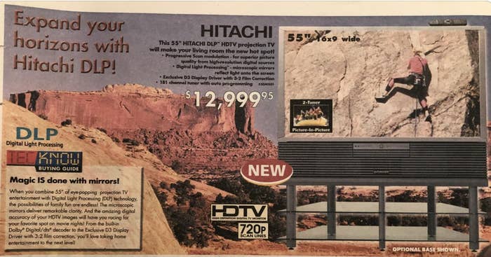for Hitachi 55" HDTV projection TV with Digital Light Processing (DLP) technology, priced at $12,999.95. Text emphasizes "Magic is done with mirrors!"