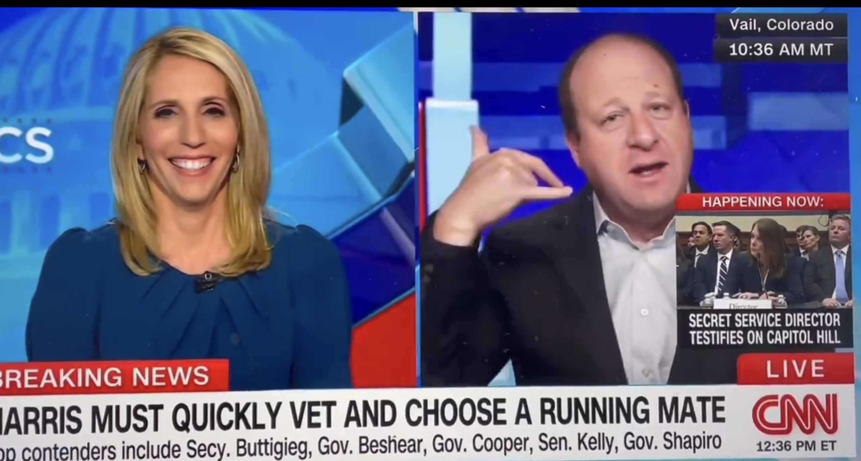 Dana Bash and Jared Polis discuss political topics on CNN in a split-screen format with news ticker at the bottom