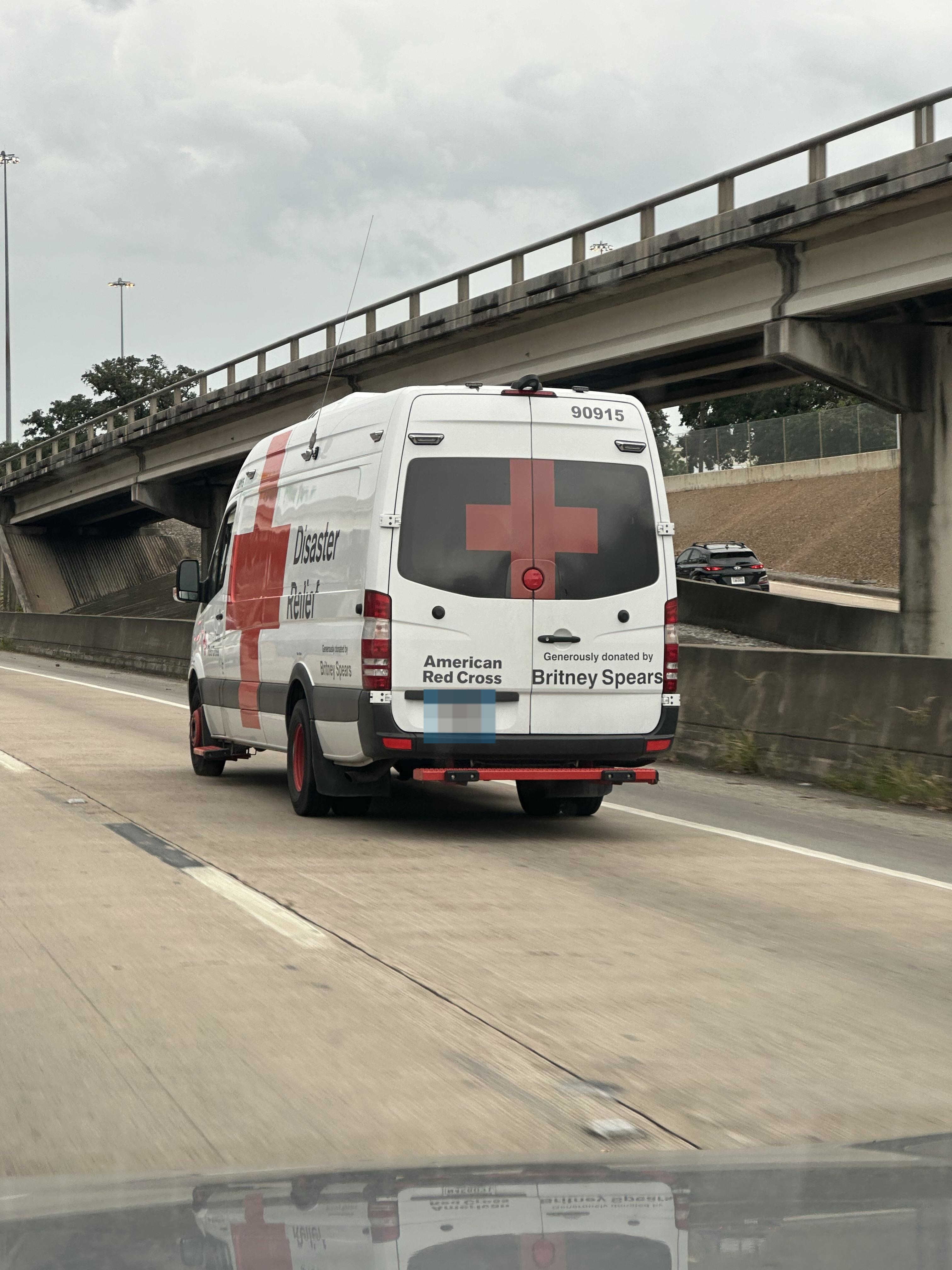American Red Cross disaster relief van on highway, sponsored by Britney Spears