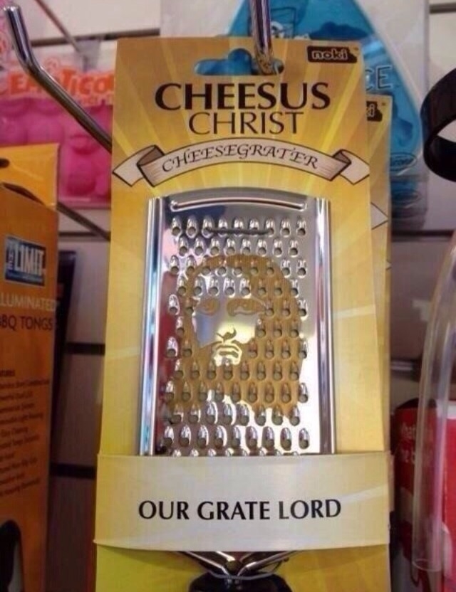 Cheese grater packaging labeled "Cheesus Christ" with an image of Jesus on the grater and the text "OUR GRATE LORD."