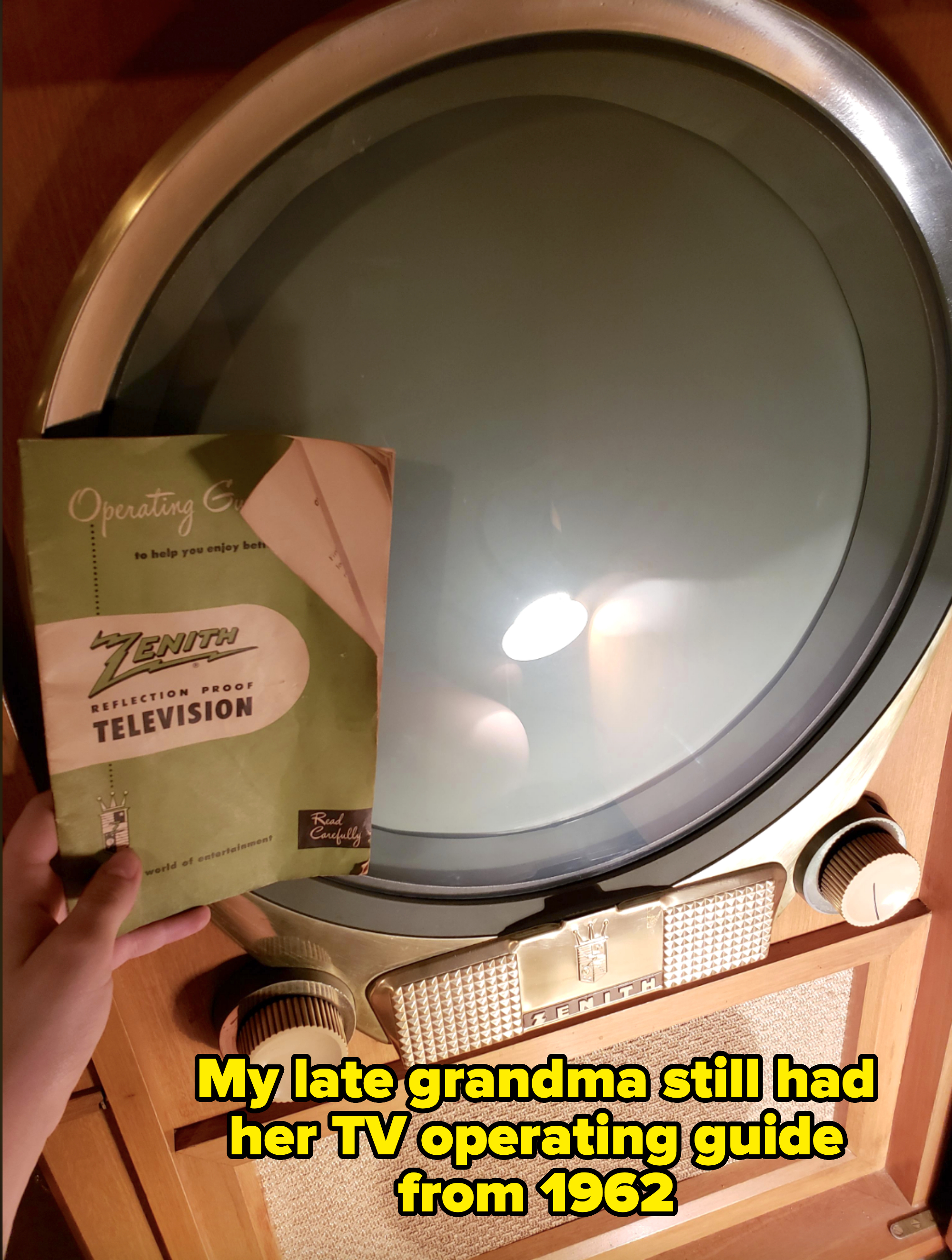 A person holds a vintage Zenith television instruction booklet next to a round screen of a retro Zenith television set