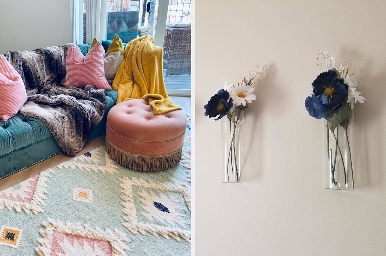 A living room displays a green velvet sofa with colorful pillows and a furry throw, next to a round ottoman. The wall features four decorative flower wall vases