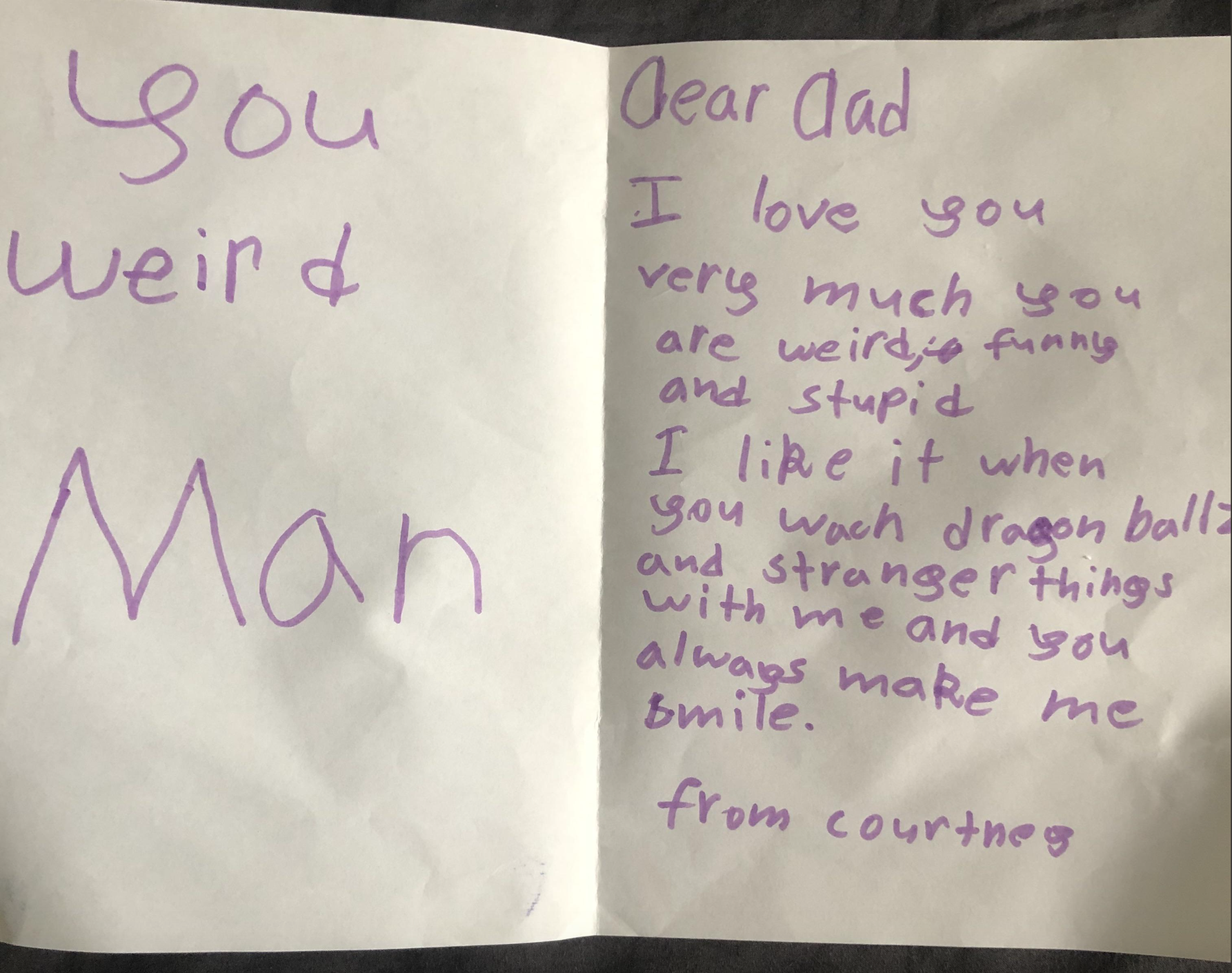 A handwritten note reads, "Dear Dad, I love you very much you are weird, funny, and stupid. I like it when you watch dragon balls and stranger things with me and you always make me smile. from Courtney". The opposite page says, "You weird Man"