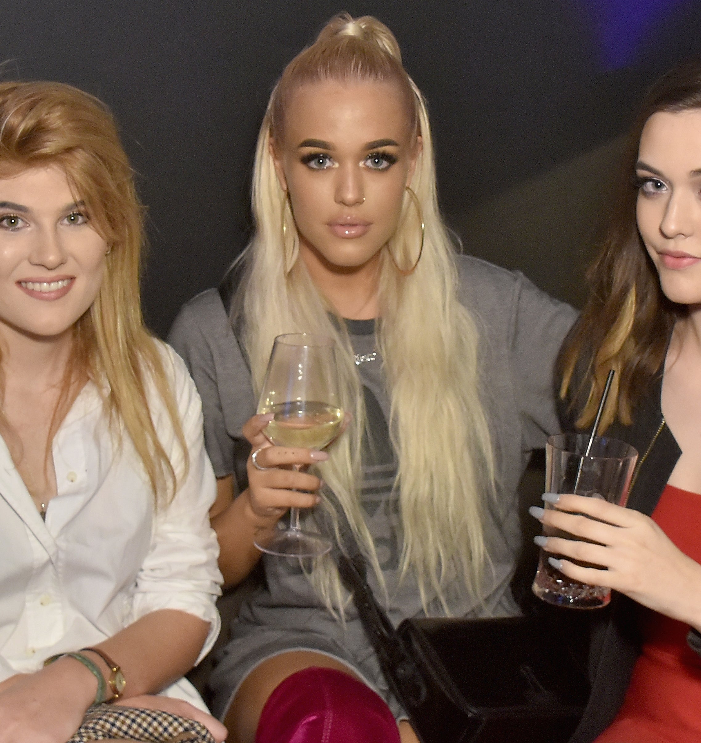 Lottie Tomlinson with Félicité has they holds drinks