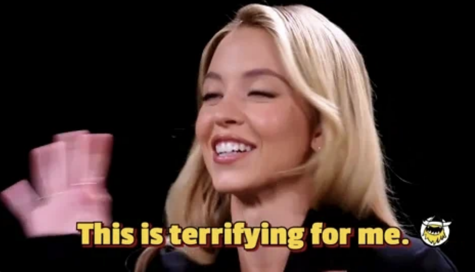 Sydney Sweeney smiling and waving with text overlay: "This is terrifying for me."