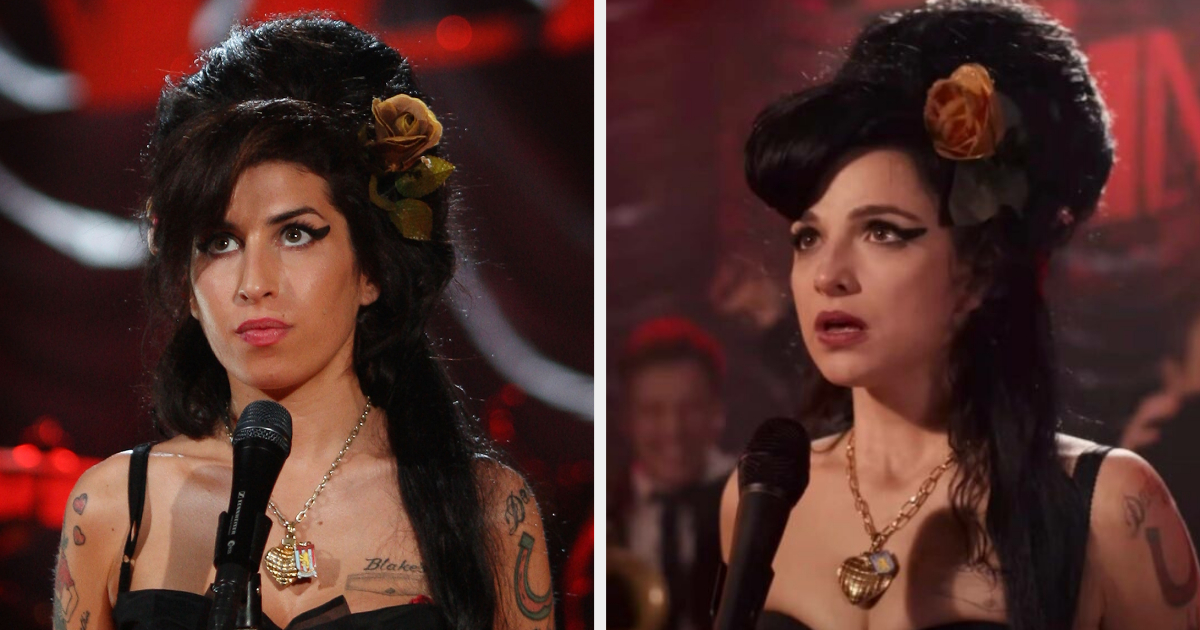 Amy Winehouse and Jaime Winstone stand side by side, both styled in black strapless dresses with large hair and gold heart necklaces, in a setting with a red and black backdrop