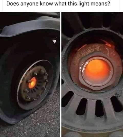 Two close-up photos of a vehicle's wheel with an orange glowing light inside the hub. Text above asks, "Does anyone know what this light means?"
